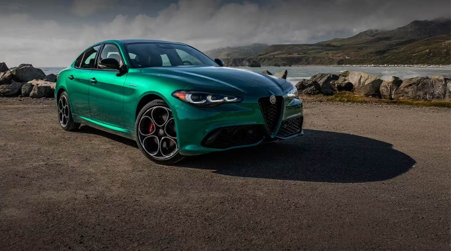 Side dynamic view of a 2026 Alfa Romeo Giulia sport sedan standing near down Route 17 in Ramsey showing its 