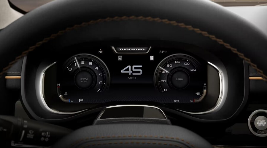 Close-up view of the 2026 Ram 1500 digital instrument cluster showing real-time speed, tachometer, and safety chime notifications for North Jersey commuters.