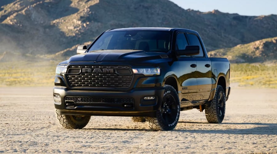 Black 2026 Ram 1500 Rebel crew cab truck featuring a blacked-out grille, front tow hooks, and Goodyear all-terrain tires, available at Ramsey CJDR off Route 17 in Bergen County, NJ.