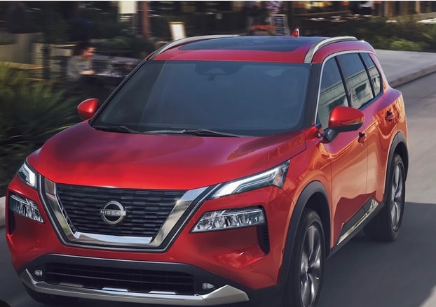 2023 nissan rogue driving around a city