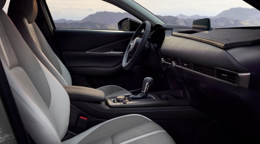 Driver cockpit view of the 2026 Mazda CX-30 interior featuring premium two-tone ergonomic leather seats, center console Commander dial, and intuitive infotainment display for daily Bergen County and Ramsey commuters.