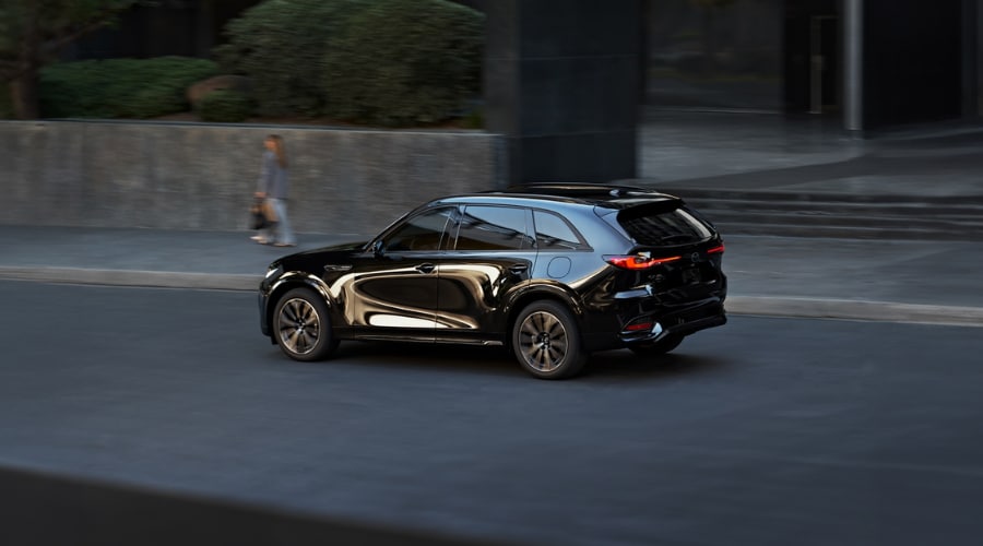 Side profile comparison of a 2026 Mazda CX-70 driving on streets of Ramsey