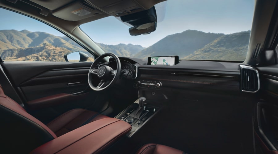 Front cabin interior of the 2026 Mazda CX-50 Hybrid featuring terracotta leather seats, 10.25-inch center display screen with navigation, and Mi-Drive console controls for North Jersey commutes.