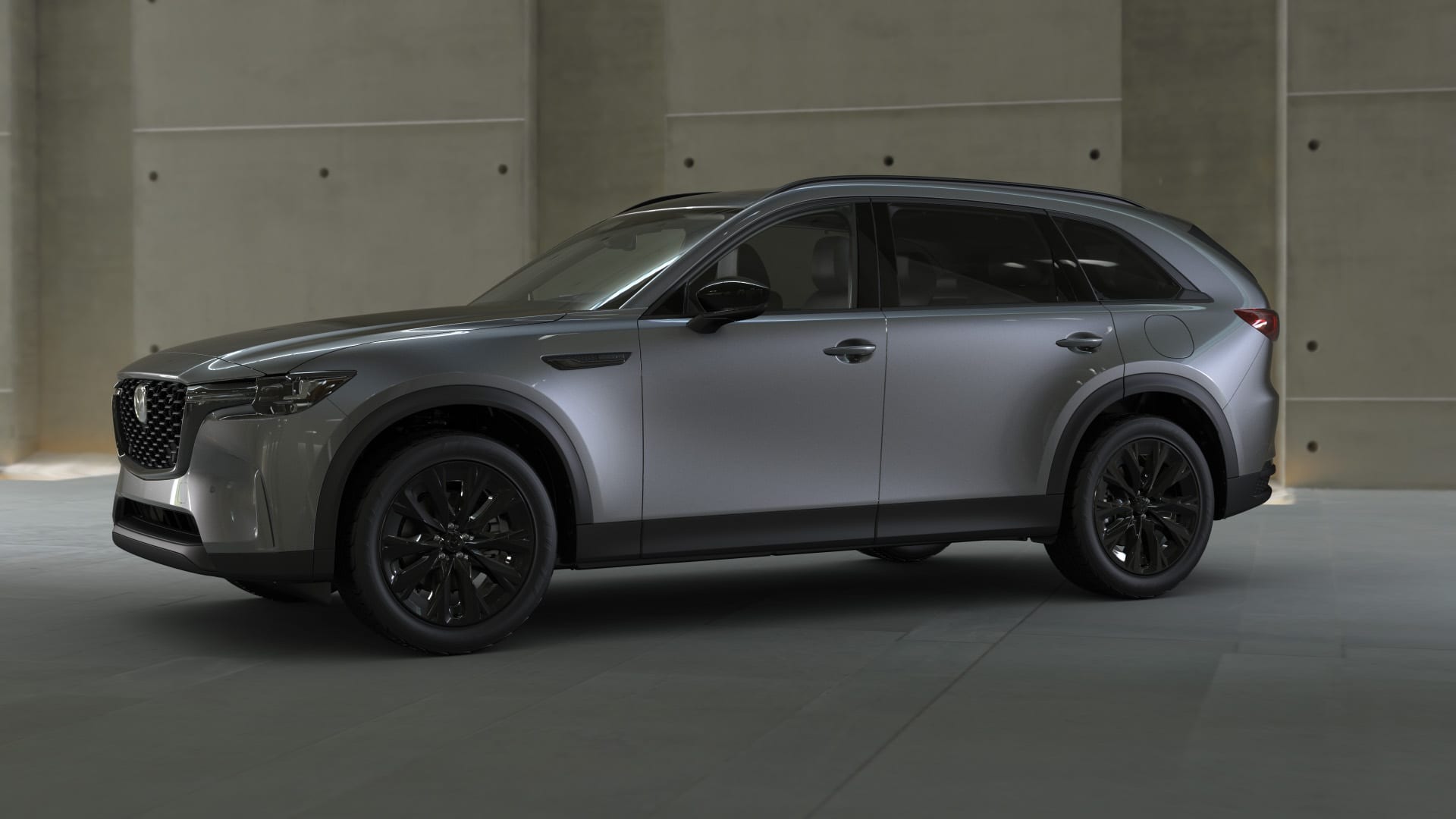 Detail of the sleek Rhodium White Premium paint on a Mazda CX-90 fender.
