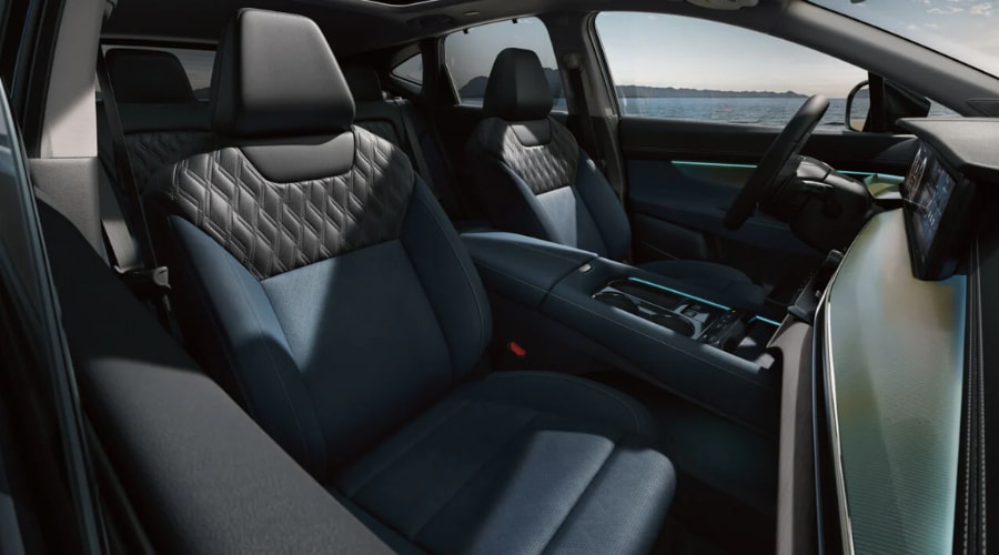 Interior cabin view of the 2026 Nissan Murano featuring two-tone blue and black quilted leather seats and a digital dashboard display for Bergen County, NJ commuters.