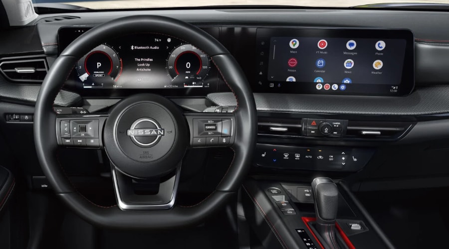 Close-up view of the 2026 Nissan Kicks dashboard showcasing dual 12.3-inch monolith displays and wireless smartphone mirroring, built to keep drivers connected during morning commutes across