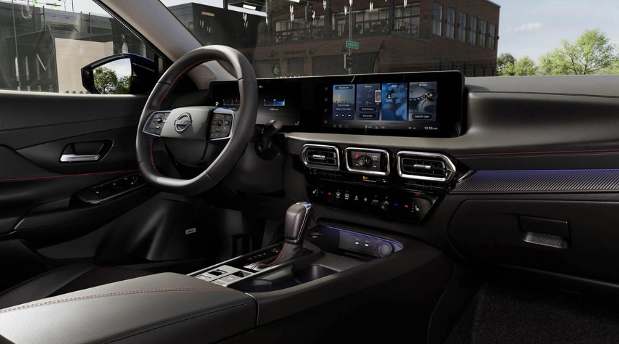 Modern 2025 Nissan Sentra interior dashboard featuring the leather-wrapped steering wheel with controls, Advanced Drive-Assist Display, and high-resolution touchscreen customized for Safety Shield 360 settings in Ramsey, NJ
