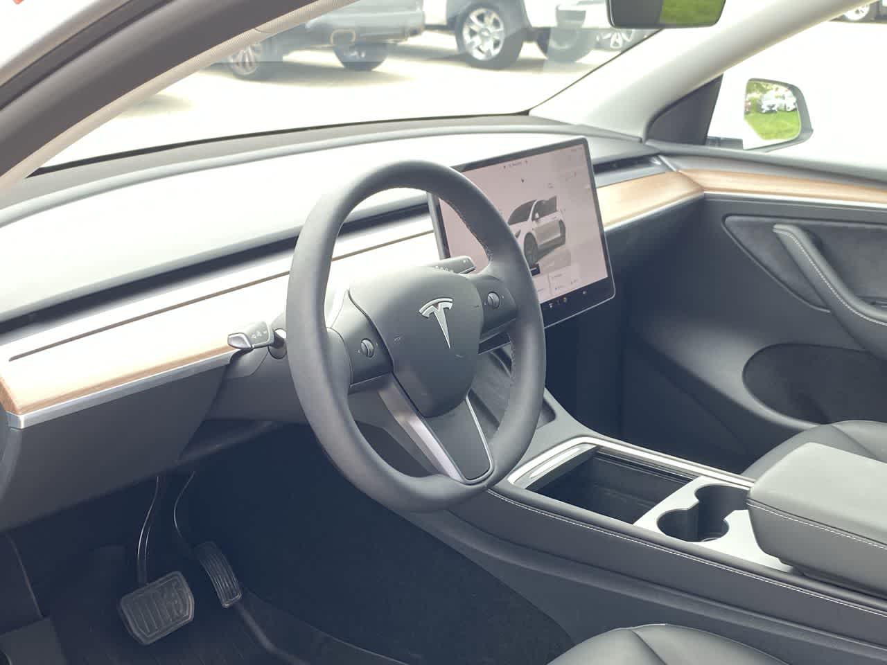 Used 2025 Tesla Model Y Long Range with VIN 7SAYGDEE2SF245965 for sale in Urbandale, IA