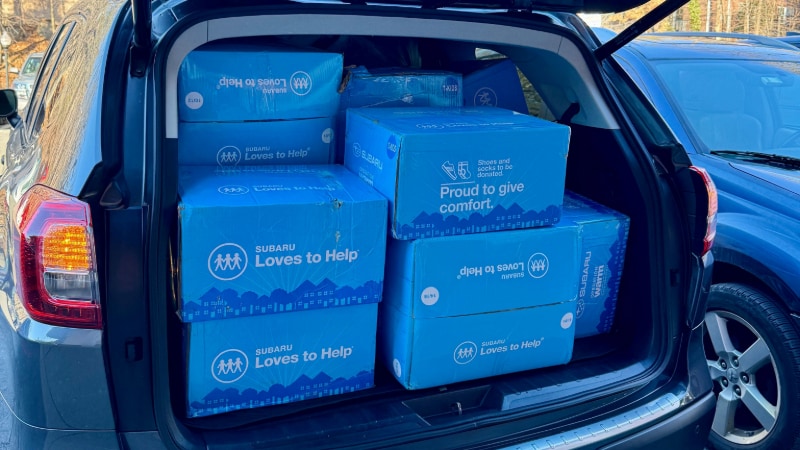 Boxes of Coats and Shoes for Ramsey Subaru's Community Event