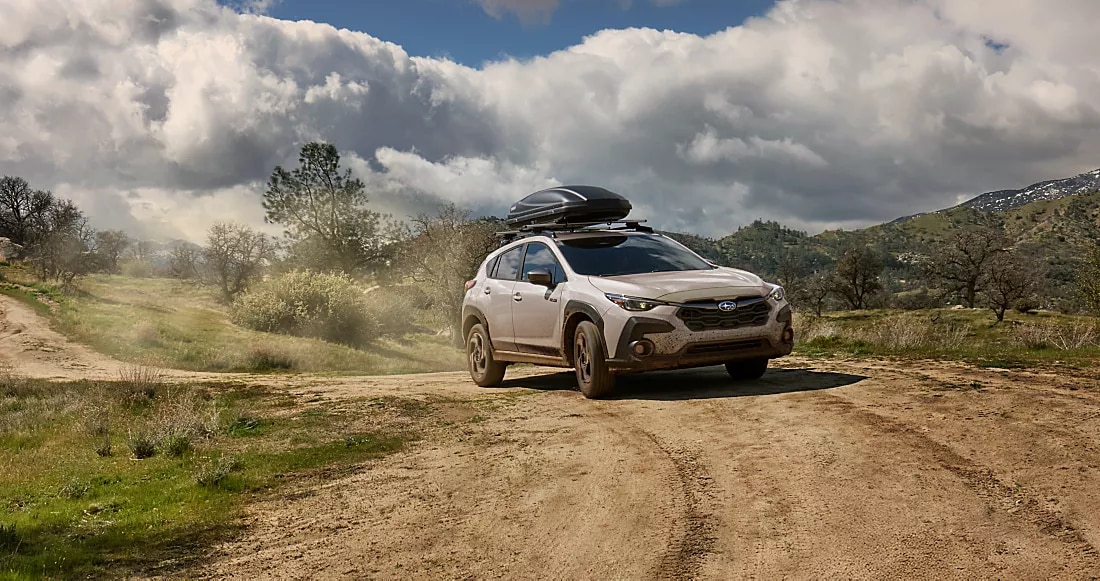 2026 Subaru Crosstrek Hybrid in sand dune pearl driving in northern nj