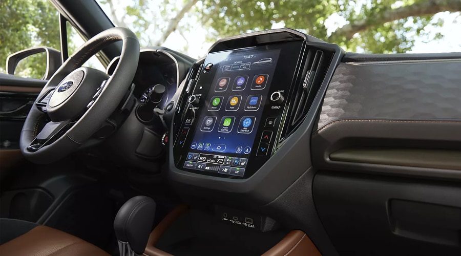 Detailed interior view of the 2026 Subaru Forester dashboard featuring the large STARLINK vertical touchscreen, dual climate controls, and X-MODE traction settings, offering intuitive driver tech for autumn commutes in Ramsey, NJ and Bergen County.