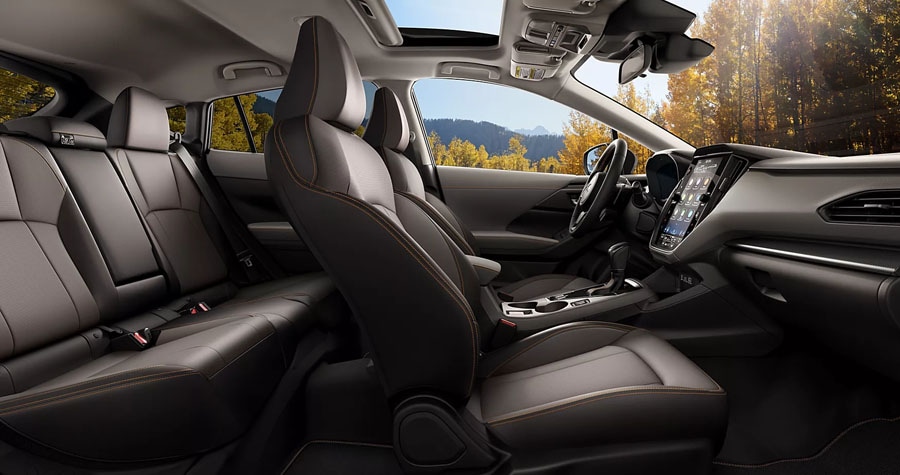 2026 Subaru Crosstrek Hybrid in Alpine Green seating Ramsey Subaru in Ramsey, NJ