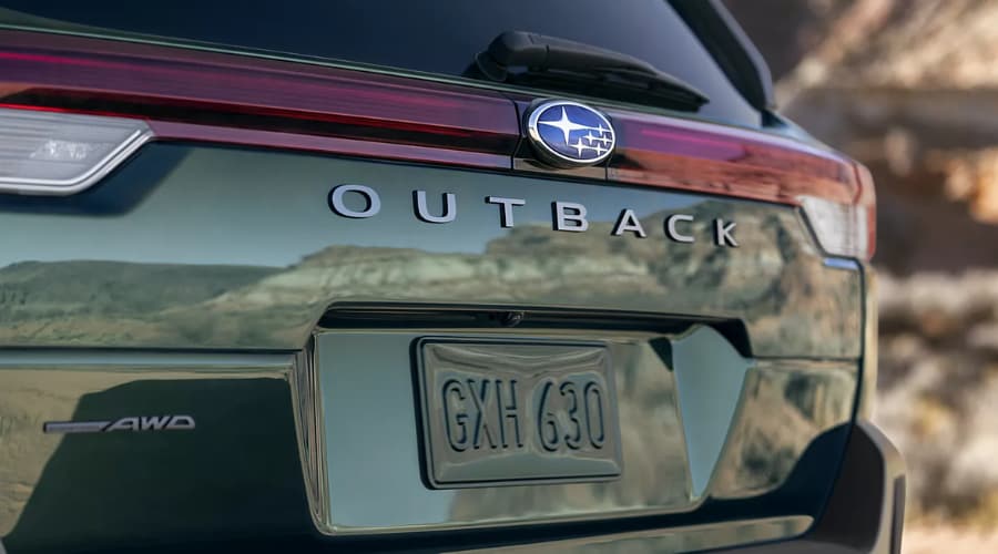 Rear tailgate of the green 2026 Subaru Outback, showing Symmetrical AWD badging for Bergen County NJ family trips