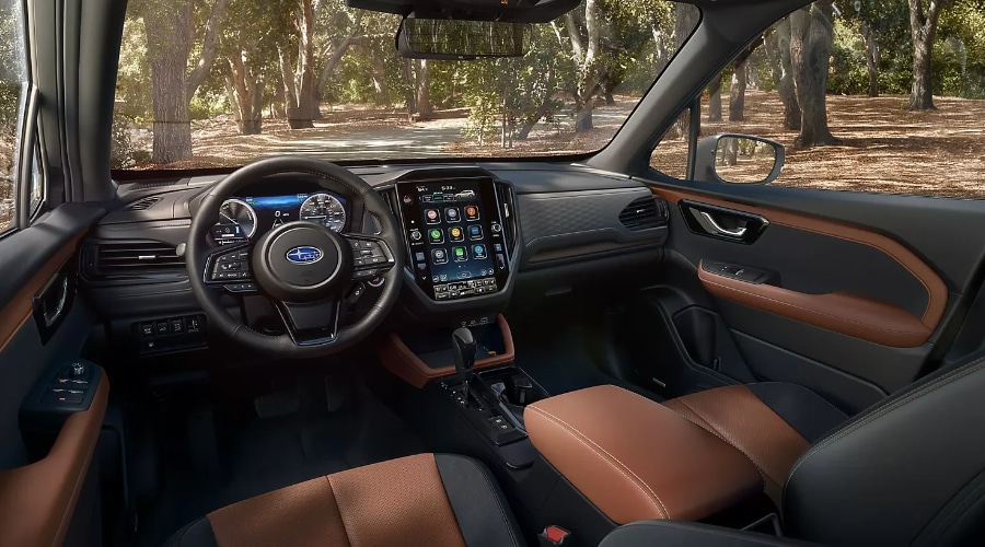 Interior cabin of the 2026 Subaru Forester featuring the 11.6-inch STARLINK multimedia touchscreen display, two-tone leather seating, and climate control interface for cold morning defogging in Ramsey, NJ