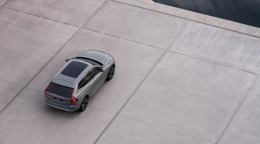 Aerial high-angle view of a 2026 Volvo XC60 in Platinum Grey featuring a panoramic sunroof near Ramsey and Bergen County, NJ