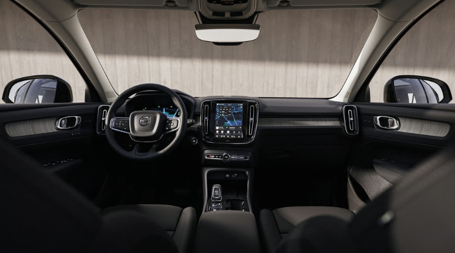 Close up view of a 2026 Volvo XC40 driver cockpit area in Ramsey showing the refined steering wheel and digital gauge cluster layout