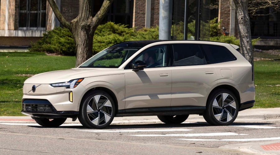 2026 Volvo EX90 electric SUV parked on city street, showcasing modern design and performance
