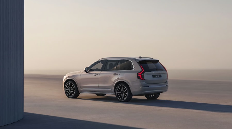 Side view of a 2026 Volvo XC90 in Upper Saddle River highlighting its spacious three-row profile and alloy wheels