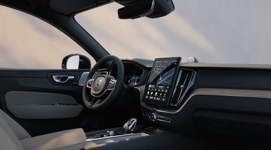 Interior cockpit view of the 2027 Volvo XC60 featuring the new standalone 11.2-inch touchscreen display with Google built-in navigation UI, digital driver cluster, and Scandinavian leather cabin trim at Volvo Cars Ramsey.