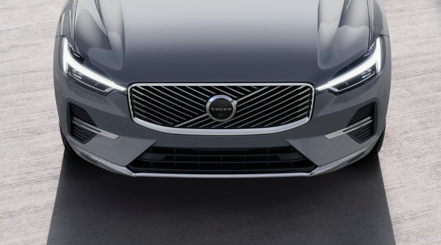 Close-up front grille and Thor's Hammer LED headlights on the 2026 Volvo XC60 in Platinum Grey at Volvo Cars Ramsey, NJ