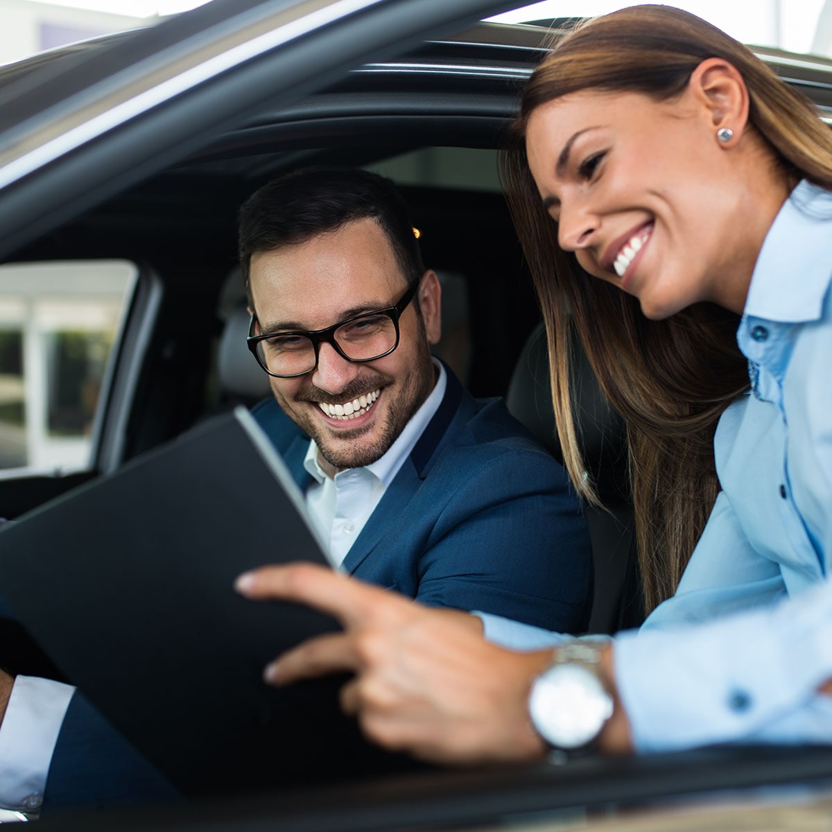  dealership-sales-rep-talking-to-customer