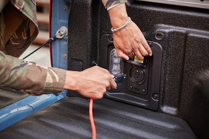 Truck bed power outlet for tools