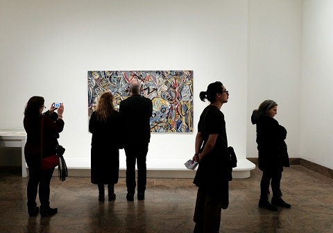 people walking through an art gallery in Plano, TX