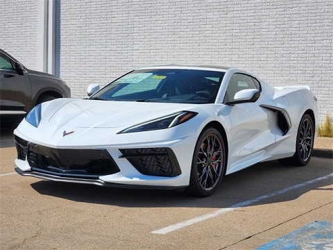 white 2025 Chevrolet Corvette sports car parked at the Huffines Chevrolet Plano dealership in Plano, TX