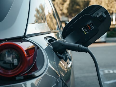 a car plugged in to a charging cable