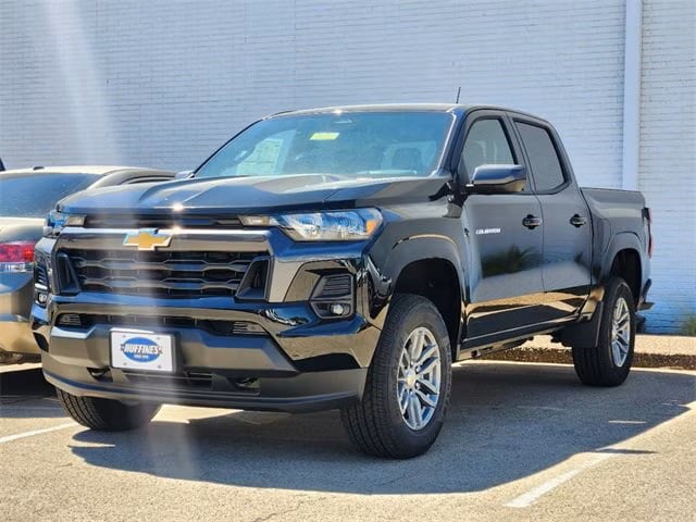 black chevrolet colorado truck parked at the Huffines Chevrolet Plano dealership in Plano, TX