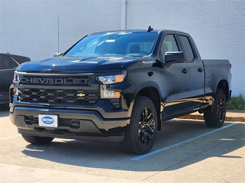 black 2025 Chevrolet Silverado 1500 truck parked at the Huffines Chevrolet Plano dealership in Plano, TX