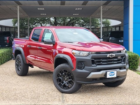 red 2026 Chevrolet Colorado truck parked at the Huffines Chevrolet Plano dealership in Plano, TX