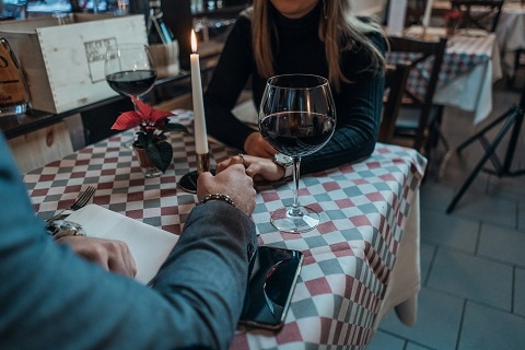people on a date sitting at a table in Plano, TX