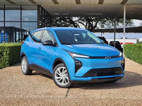 blue chevy bolt EV parked at the Huffines Chevrolet Plano dealership in Plano, TX