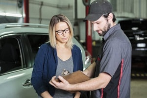Mechanic Explaining Work to Customer
