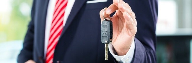 Salesman Handing Car Keys Over