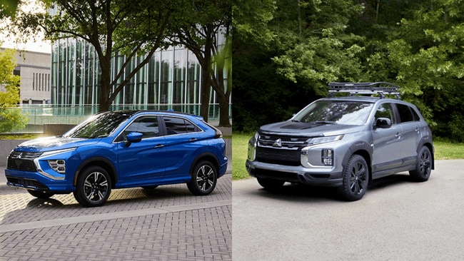 Blue Eclipse Cross and gray Outlander Sport parked outdoors for side-by-side comparison in Reading, PA