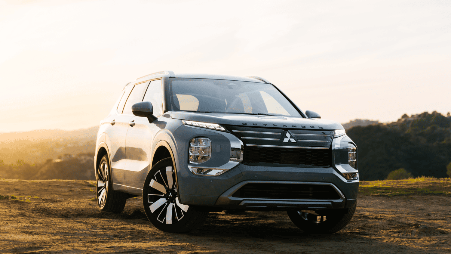 2025 Mitsubishi Outlander SUV next to Toyota RAV4, lifestyle comparison for Pennsylvania drivers