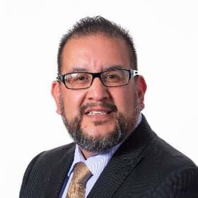 Staff member Gil Archuleta from ID_696715