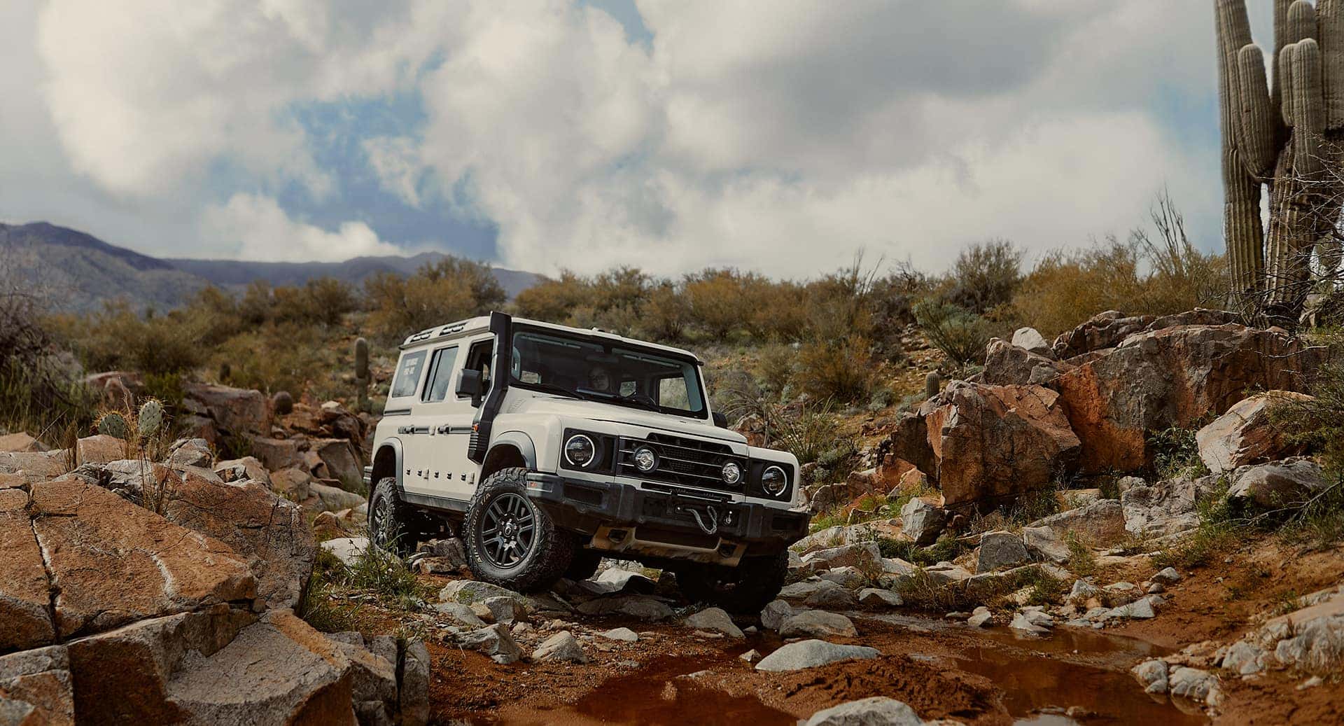 INEOS Grenadier traversing rocky terrain