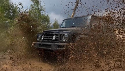 INEOS Grenadier driving off-road during a 301 winching and recovery class