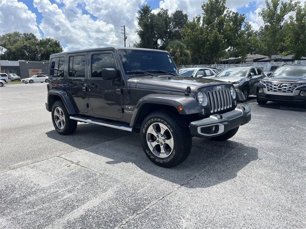 Used 2016 Jeep Wrangler Unlimited Sahara with VIN 1C4HJWEG5GL273730 for sale in Lakeland, FL