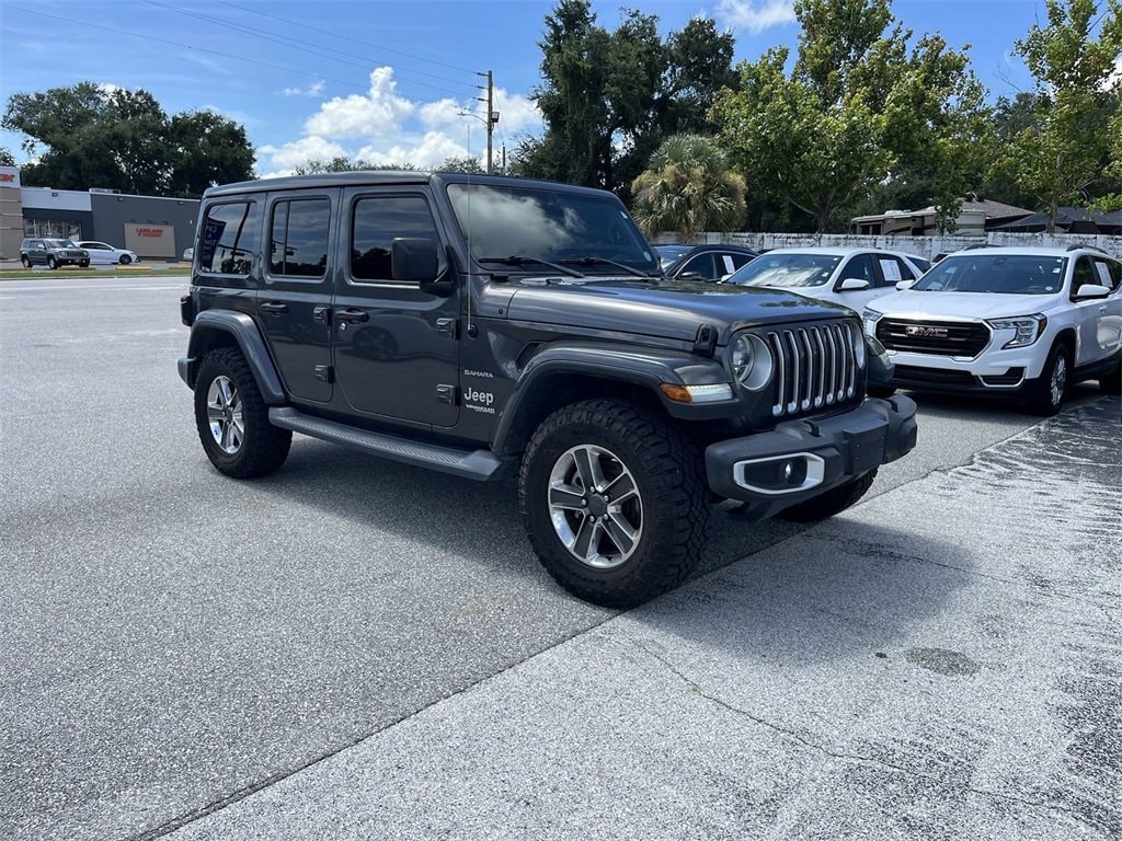 Used 2019 Jeep Wrangler Unlimited Sahara with VIN 1C4HJXENXKW590723 for sale in Lakeland, FL