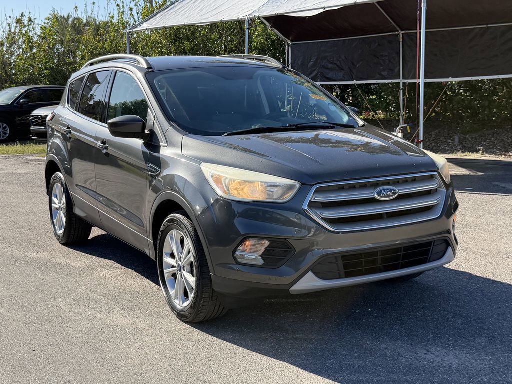 Used 2018 Ford Escape SE with VIN 1FMCU9GD3JUA10879 for sale in Lakeland, FL