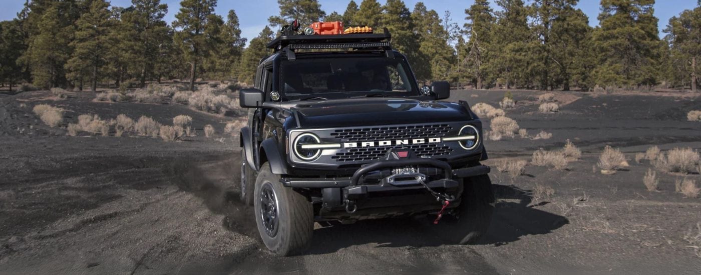 A black 2025 Ford Bronco parked off-road