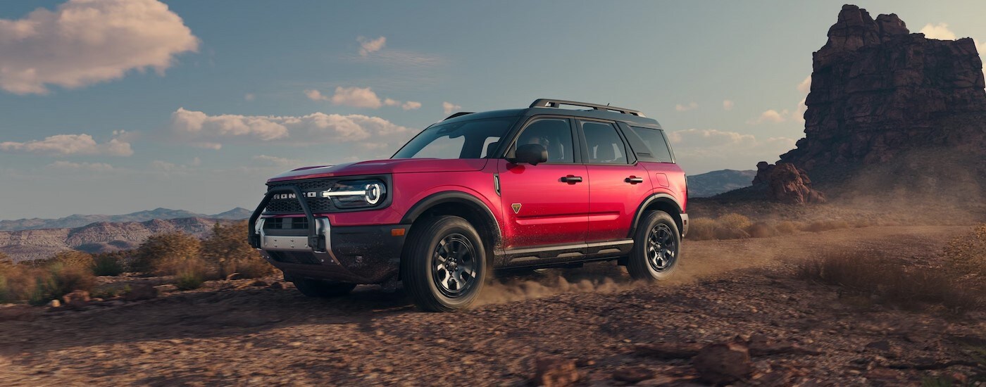 A red 2025 Ford Bronco Sport off-roading.