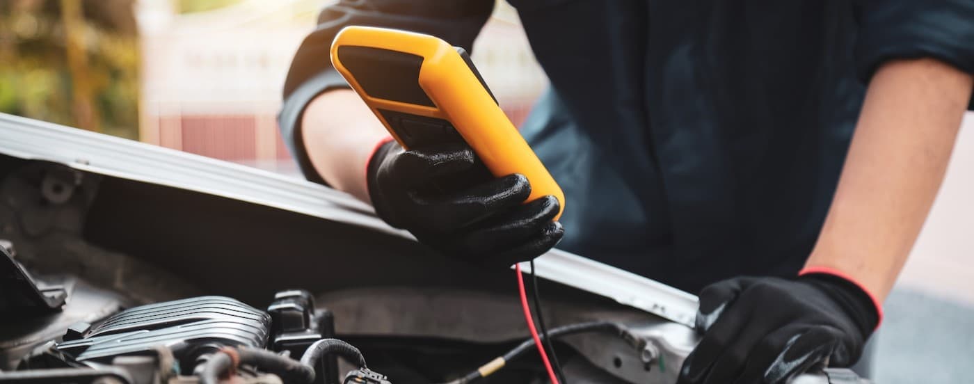 A technician using a voltmeter.