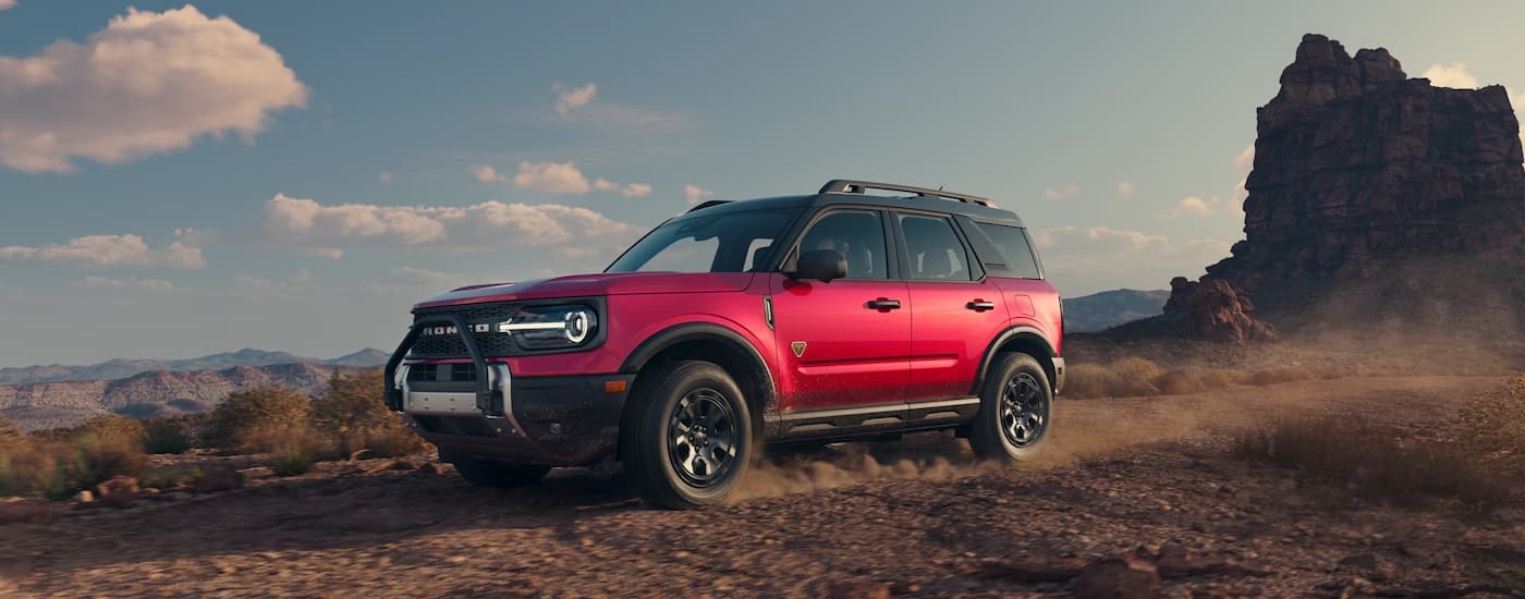 Red 2025 Ford Bronco Sport Badlands off-roading through a desert