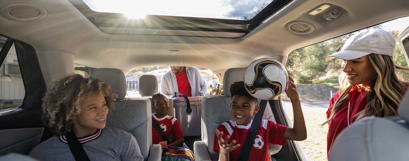 A family sitting in a 2025 Ford Explorer.