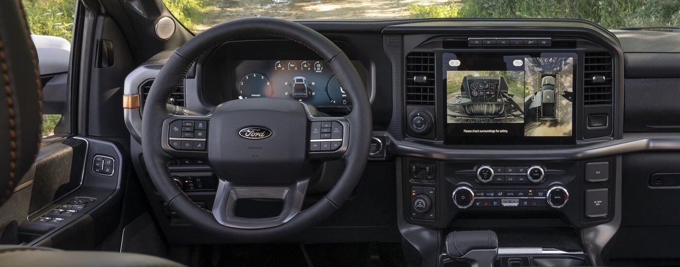 The steering wheel and infotainment screen in a 2024 Ford F-150 Tremor.